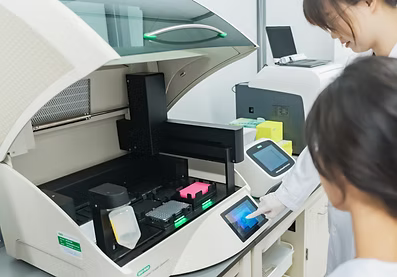 Researcher with microscope